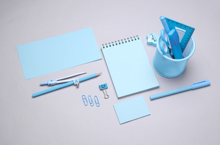 Blue Stationery set on gray background. Back to school, education, office supplies. Flat lay. Top view. Creative layoutの写真素材