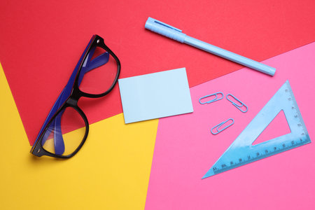 Stationery set on colored background. Back to school, education, office supplies. Flat lay. Top view. Creative layoutの写真素材