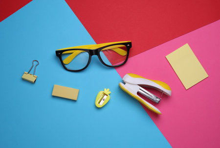 Stationery set on colored background. Back to school, education, office supplies. Flat lay. Top view. Creative layoutの写真素材