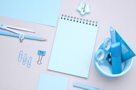 Blue Stationery set on gray background. Back to school, education, office supplies. Flat lay. Top view. Creative layoutの写真素材