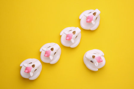 Rubber bath unicorns on a yellow background. Top view. Creative layoutの写真素材