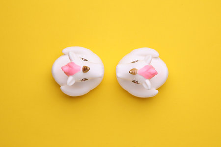 Rubber bath unicorns on a yellow background. Top view. Creative layoutの写真素材