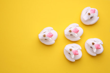 Rubber bath unicorns on a yellow background. Top view. Creative layoutの写真素材