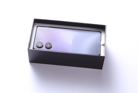 New modern smartphone in a box on a white backgroundの写真素材