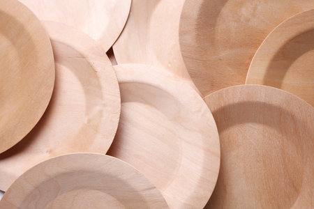 Stack of eco wooden plates close upの写真素材