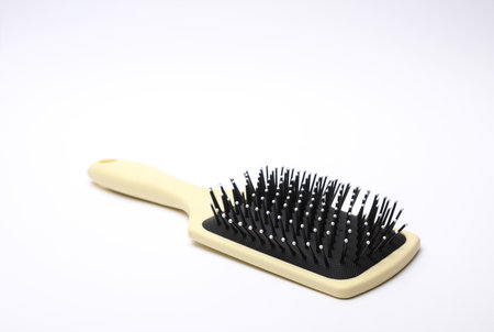 Hair brush, plastic comb on white backgroundの写真素材