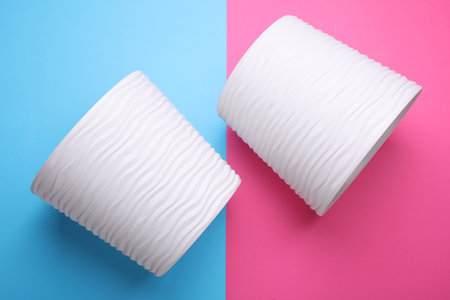 Plastic flowerpots on pink blue backgroundの写真素材