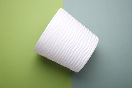 White Plastic flowerpot on a green backgroundの写真素材