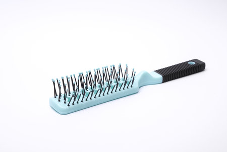 Hair brush, plastic comb on white backgroundの写真素材