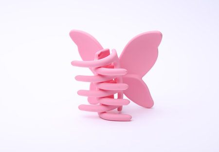 Pink plastic hair clip on white backgroundの写真素材