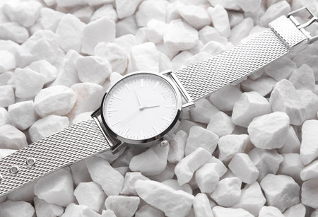 Women's Silver Wristwatch on White Pebblesの写真素材