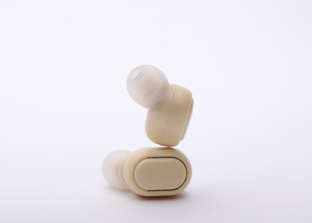 Wireless vacuum headphones on white backgroundの写真素材