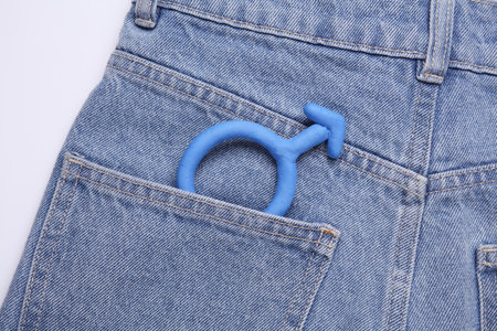 Male blue gender symbol in jeans pocketの写真素材