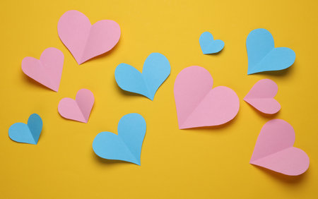 Paper hearts on a yellow background. Love conceptの写真素材