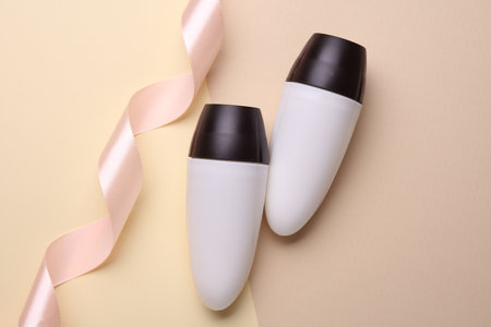 White antiperspirant tube sticks on pastel background