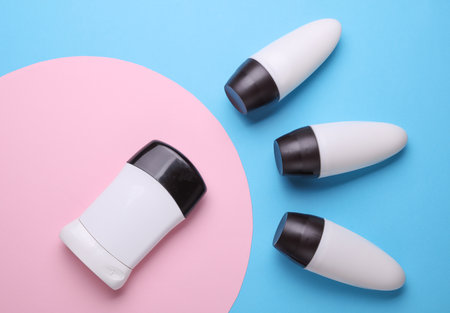 White antiperspirant tube sticks on pink blue background