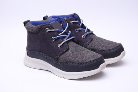Children's warm sneakers half-boots on a white background