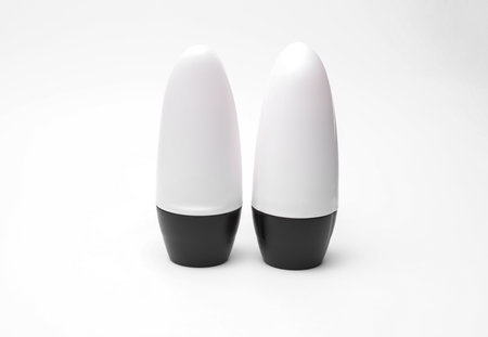 White antiperspirant tube sticks on white background