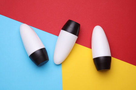 White antiperspirant tube sticks on colored background. Top viewの写真素材
