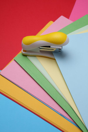 Stapler and Set of Colored Paper Sheetsの写真素材