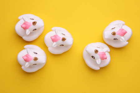 Rubber bath unicorns on a yellow background. Top view. Creative layoutの写真素材