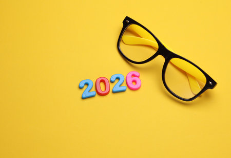 2026 year text with multicolored numbers and eyeglassesの写真素材