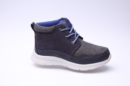 Children's warm sneaker half-boot on a white backgroundの写真素材