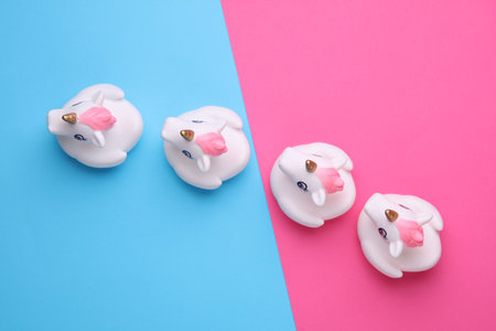 Rubber bath unicorns on a pink blue background. Top view. Creative layoutの写真素材