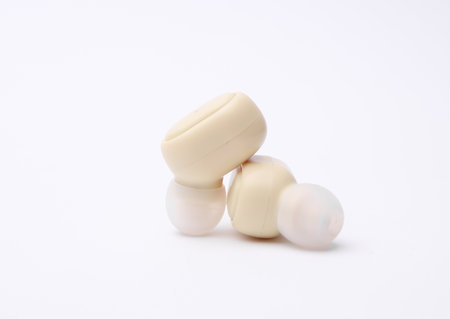 Wireless earphones on white backgroundの写真素材