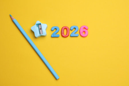 2026 year text with multicolored numbers and pencilの写真素材