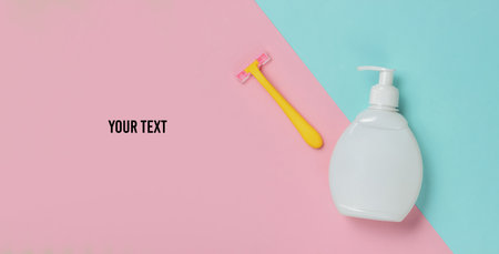 Bottle of gel for depilation, razor on a colored paper background with space for your text. Pastel...