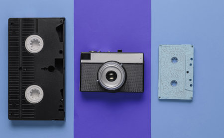 Entertainment and media 80s. Pop culture objects on a colored paper background. Top view. Minimalism