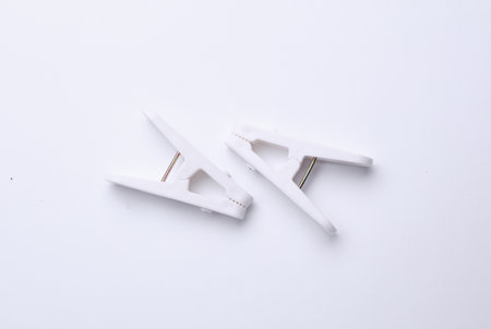 Plastic clothespins on a white backgroundの写真素材