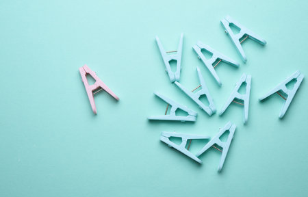 Plastic clothespins on a blue background