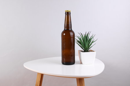 Bottle of beer on the coffee tableの写真素材