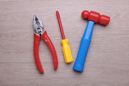 Set of children's toy tools on a tableの写真素材