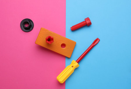 Set of children's toy tools on a pink blue background. Flat layの写真素材
