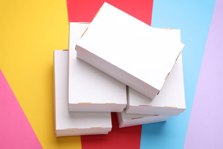 White cardboard boxes on a colored background