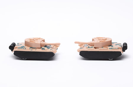 Plastic toy tanks on white backgroundの写真素材