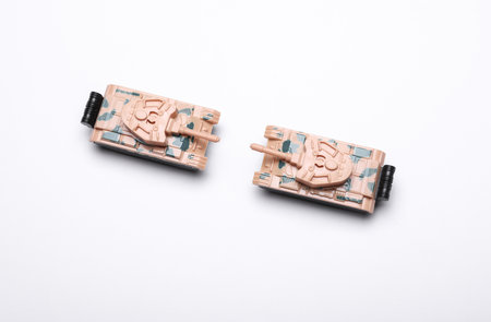 Plastic toy tanks on white backgroundの写真素材
