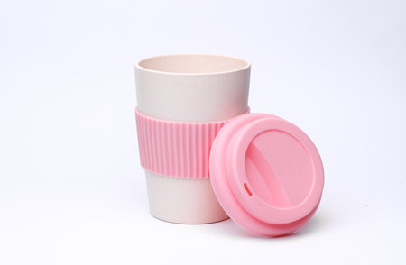 Reusable eco cup for hot drinks isolated on white background.
