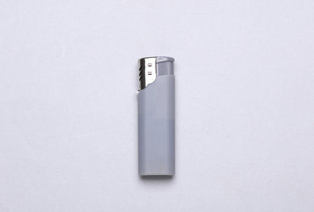 Plastic lighter on a gray background