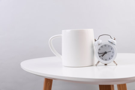 White ceramic cup on table