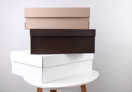 Cardboard shoe boxes on a table