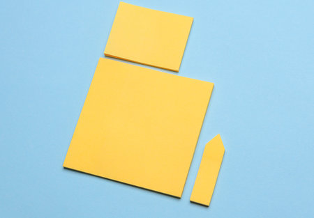 Various blank paper multicolored stickers. Sticky note collection on blue background