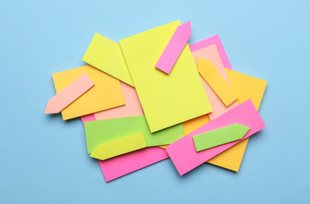 Various blank paper multicolored stickers. Sticky note collection on blue background
