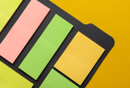 Various blank paper multicolored stickers. Sticky note collection on yellow background