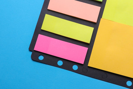 Various blank paper multicolored stickers. Sticky note collection on blue background