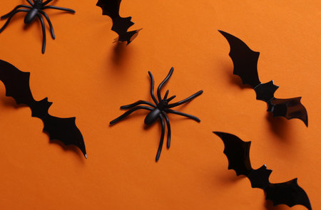 Halloween decoration spiders and bats on orange backgroundの写真素材