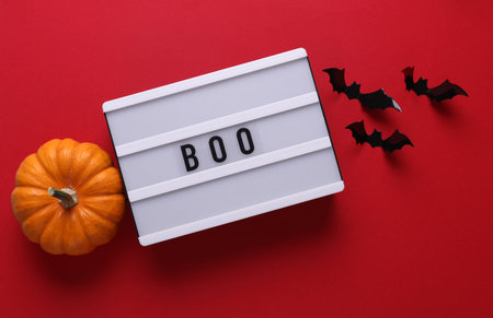 Halloween concept. Lightbox with text BOO and holiday decoration. Flat lay. Top viewの写真素材